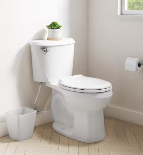 American Standard Reliant 12 in. Rough In 2-Piece 1.28 GPF Single Flush Round Toilet with Slow Close Seat